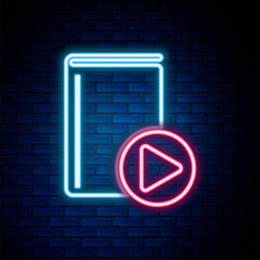 Glowing neon line Audio book icon isolated on brick wall background. Play button and book. Audio guide sign. Online learning concept. Colorful outline concept. Vector