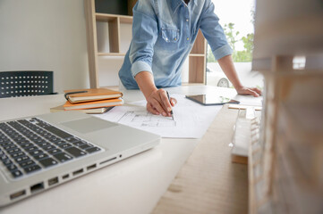 Architecture drawing on architectural project business architecture building construction Colleagues interior designer Corporate. Planning Design on blueprint Teamwork with compasses.