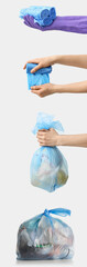 Housewife using trash bags for garbage collection on white background