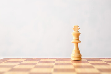 Chess board with king on white background