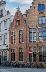 Fototapeta na wymiar Facades and roofs of houses in the Gothic style. Bruges, Belgium