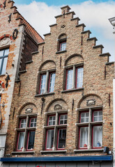 Fototapeta na wymiar Facades and roofs of houses in the Gothic style. Bruges, Belgium