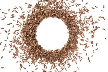 Close up caraway seeds. Dried caraway seeds isolated on white background. Pile of cumin seeds. Seasoning for food cooking of worldwide kitchen. Top close up view.