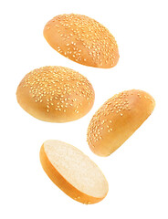 Sesame buns, whole and cut falling, round burger bun hanging, flying, soaring isolated on white background, element of packaging design. Full depth of field.