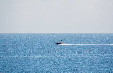 Naklejka premium Motor boat in the blue calm sea.