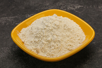 Wheat flour heap in the bowl