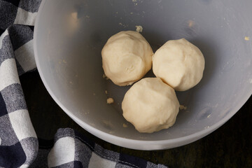 Preparation of corn arepas, accompanied by butter and salt for a typical breakfast in Colombia