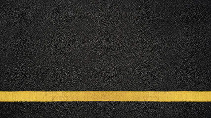 Fototapeta premium Surface grunge rough of asphalt, Seamless tarmac dark grey with yellow line on the road and small rock, Texture Background, Top view