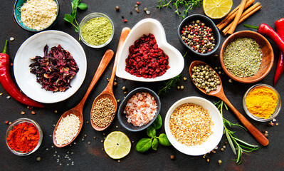 Various spices in a bowls on a black