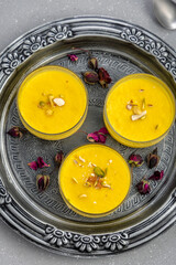 mango-flavored Phirni served in  glass bowls