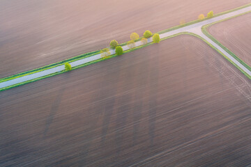 Aerial view of agricultural landscape with fields with a country road next to the fields. Photo...