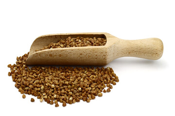 Buckwheat in a wooden scoop isolated on white