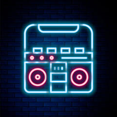 Glowing neon line Home stereo with two speakers icon isolated on brick wall background. Music system. Colorful outline concept. Vector