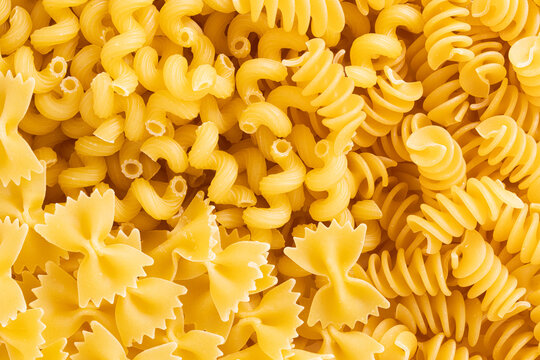 Variety of types and shapes of dried Italian pasta. Italian pasta background