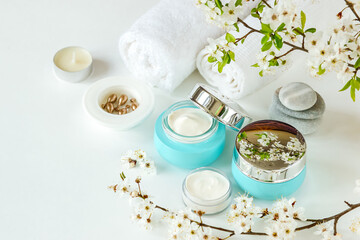 Cosmetic cream in a glass container and serum capsules. Natural spa cosmetics. 