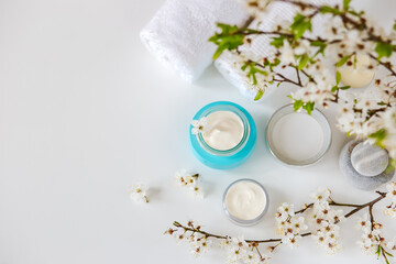 Obraz na płótnie Canvas Cosmetic cream in blue glass jars. Natural spa cosmetics. copy space