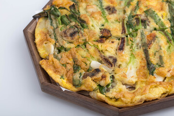 Delicious seafood and green onion pancake on a plate.
