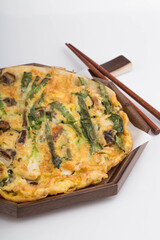 Delicious seafood and green onion pancake on a plate.