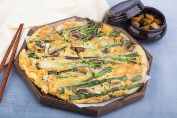 Delicious seafood and green onion pancake on a plate.
