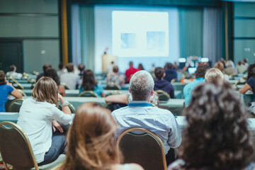 Audience in lecture hall on scientific conference.
