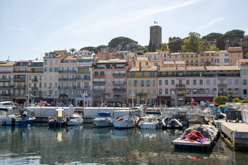 Fototapeta na wymiar The fishing port in Cannes on the French riviera looking towards the La Castre castle