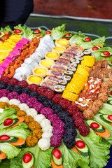 A large platter of Guangxi ethnic cuisine, colorful glutinous rice and miscellaneous grains