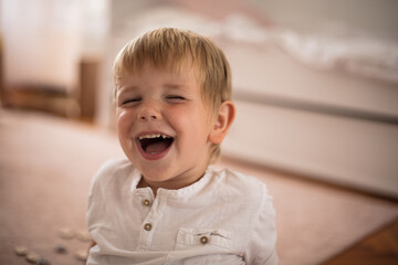 Smiling little boy at home.