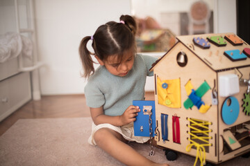 Toddler playing interactive games for good development at home.