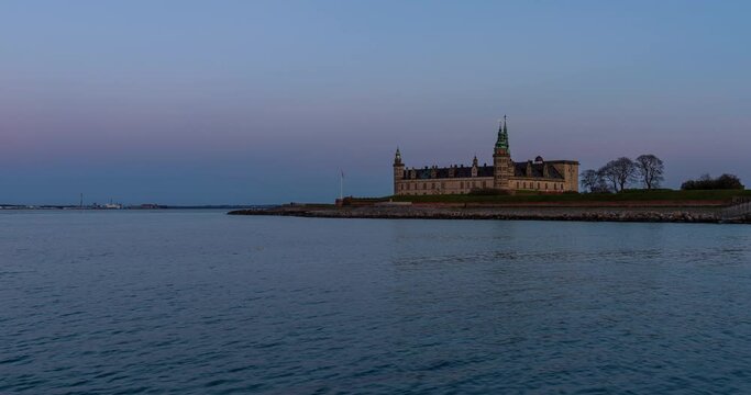 Sunset and moonrise at Kronborg Castle in Helsing&oslash;r, Denmark
