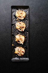 Bruschetta with camembert cheese and sauce, top view