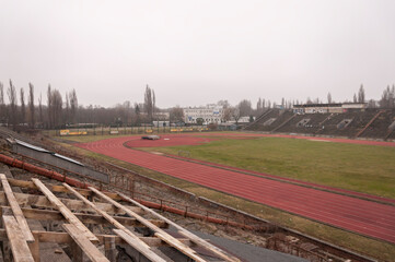 Fototapeta na wymiar Old abandoned athletics stadium in the center of Warsaw 