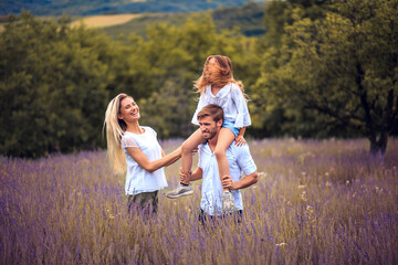 Portrait of smiling family in lavender field.