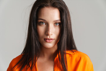 Young brunette woman wearing shirt posing and looking at camera