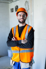 Young handsome worker smiling and looking at the camera