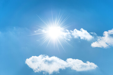Sun with sun rays on blue sky with clouds