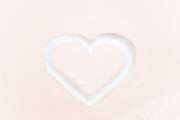 Red heart shape drawing on white snow as love valentine background