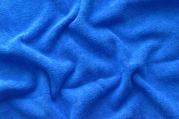 Blue microfiber cloth with wrinkles texture background. 