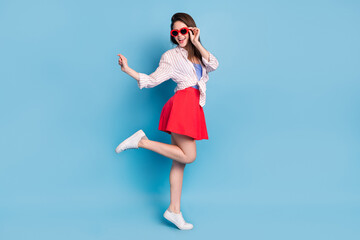 Obraz na płótnie Canvas Full length body size view of attractive cheerful girl posing dancing having fun touching specs isolated over bright blue color background