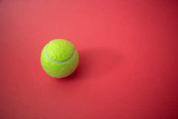 tennis ball on the court red background