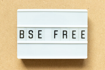 Lightbox with word BSE (bovine spongiform encephalopathy) free on wood background