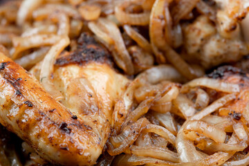 Fried chicken with onions. Chicken wings