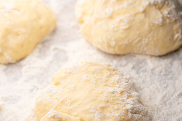 Fototapeta na wymiar Dough and flour for further baking