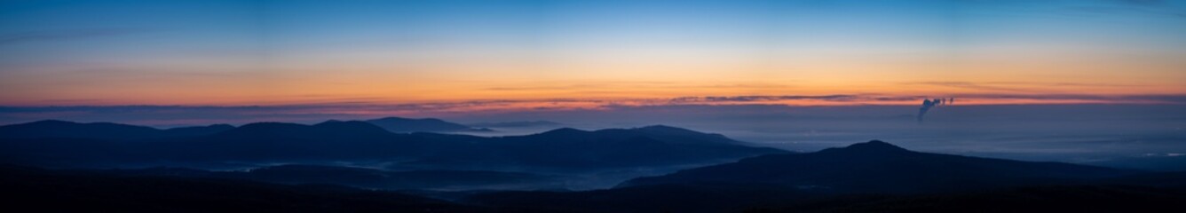 Naklejka na ściany i meble sunrise panorama over the mountains