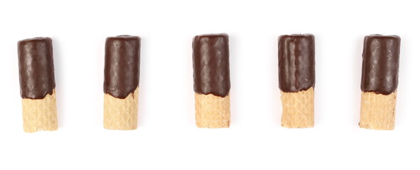Waffle rolls partially covered with chocolate set and collection isolated on white background, top view