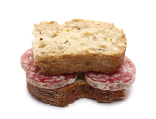 Fermented semi-hard dried sausage pieces sandwich with bread slices, pig meat isolated on white background