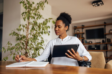 Workplace, home office, black woman working online.