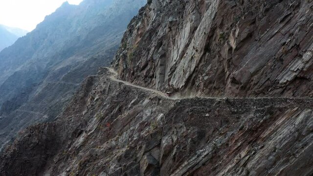 Car driving on the dangerous mountain road to Fairy Meadows, Himalaya