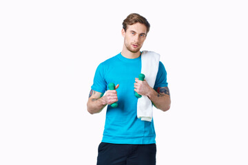 sporty man in blue t-shirt towel on shoulders workout fitness