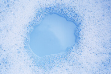 Water impregnated with soap, top view. Hand washing laundry - obrazy, fototapety, plakaty