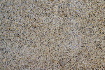 Gray cemented background with tiny stones. Copy space.
